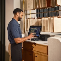 Restaurant management software interface on a tablet